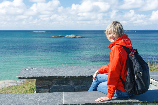 Happy Woman Enjoying Sea / Ocean / Fjord View