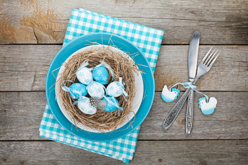 Easter eggs nest on plate