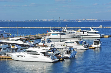 Fototapeta premium White motor yacht over harbor pier, Odessa, Ukraine