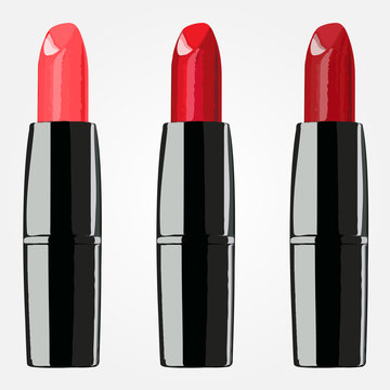red lipsticks on the white background