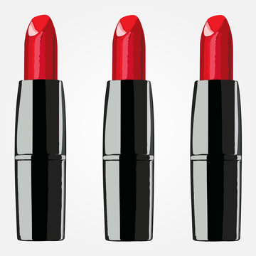 red lipsticks on the white background