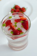 Strawberries in glass with mint