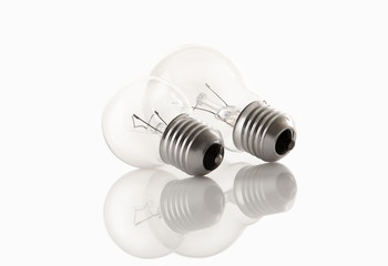 two light bulbs isolated on white with reflects