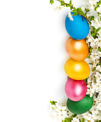 Easter background with eggs and spring flowers, text space