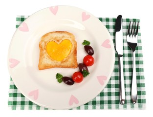 Scrambled eggs with bread on plate, on color napkin