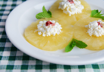 Tasty pineapple with cottage cheese, close up