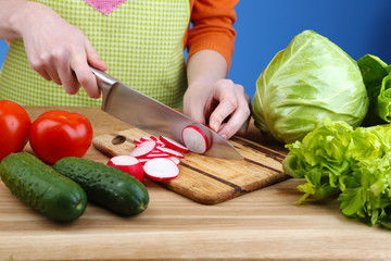Female hands cutting celery