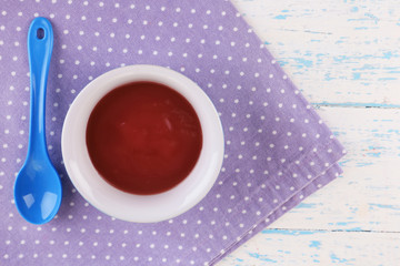 Baby food on wooden table