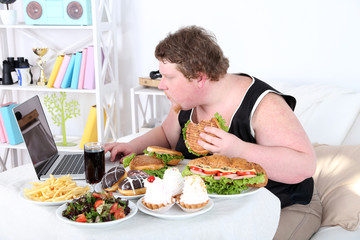 Fat man has a big lunch and playing games