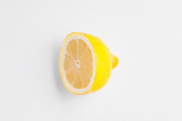 Half of a fresh lemon on white