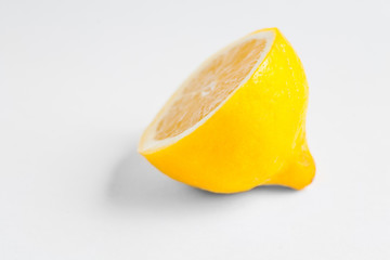 Half of a lemon on white