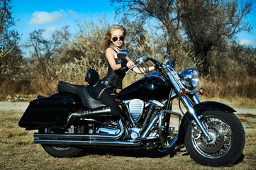 Fototapeta na wymiar Stylized photo of young beautiful woman and bike