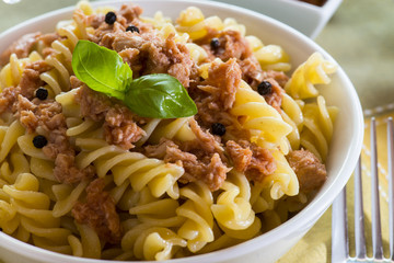 italian pasta with tuna, black peppers and tomatoes