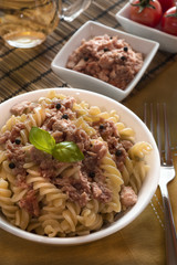 italian pasta with tuna, black peppers and tomatoes