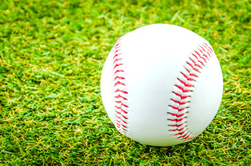 Baseball on green grass