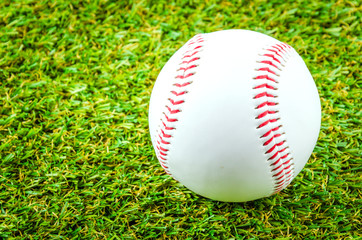 Baseball on green grass