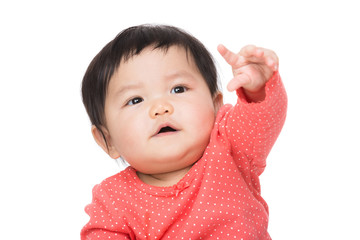 Asian baby girl finger pointing up