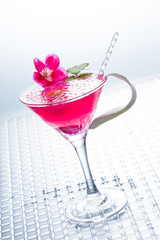 Cocktail with caviar and flower petals