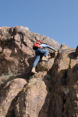 Mountaineer climbs to the top