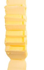 Fresh butter slices in a row