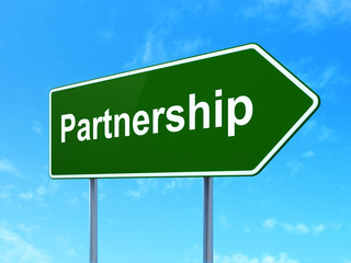 Business concept: Partnership on road sign background