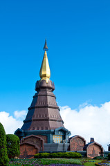 The modern thai style pagoda with blue sky and garden in Thailan