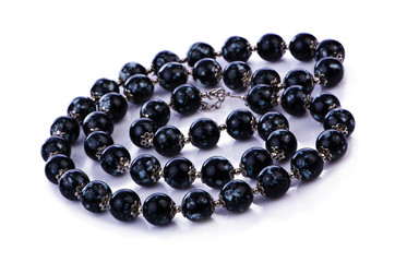 Dark pearl necklace isolated on the white