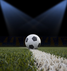 Soccer ball on the green field