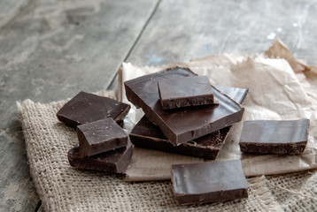 Chocolate pieces on wooden table
