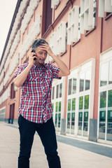 Fototapeta premium Man in short sleeve shirt talking on phone