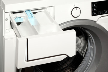 Close-up of detergent box in washing machine.