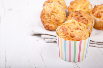 Savory cheese and bacon muffins on the white table