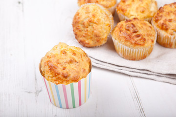 Savory cheese and bacon muffins on the white table