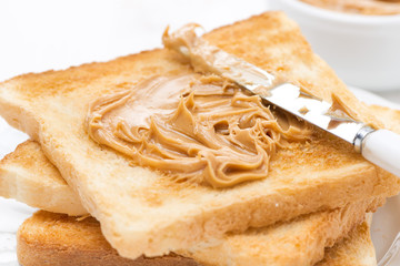 crispy toast with peanut butter, close-up