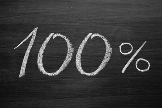 Fototapeta 100-percent title written with a chalk on the blackboard