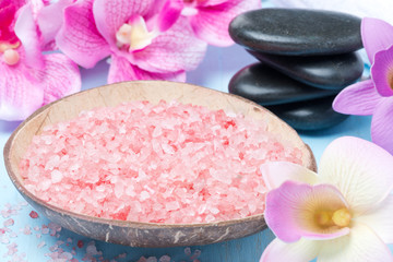 Obraz na płótnie Canvas pink sea salt, stones for spa, flowers and towels