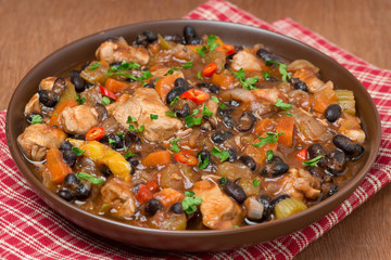 stew with black beans, chili, chicken and vegetables, close-up