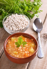 Bean soup on wooden table