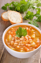 Bean soup on wooden table