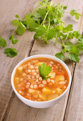 Bean soup on wooden table