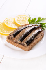 Sprats sandwich and lemon slices