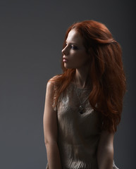 Red-haired girl looking away with contempt
