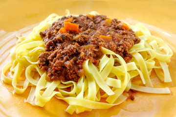 Italian meat sauce pasta on the table