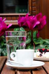 White espresso cup at the street cafe table