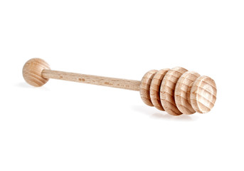 Wooden spoon for honey on a white background