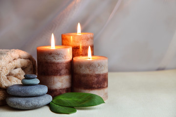 Obraz na płótnie Canvas Spa setting with massage stones