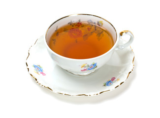 tea in vintage cup isolated on white