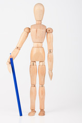 Small wood mannequin standing with colour pencil isolated on whi