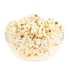 Glass bowl full of popcorn isolated