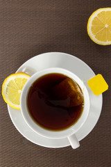 Tea cup and slice of lemon